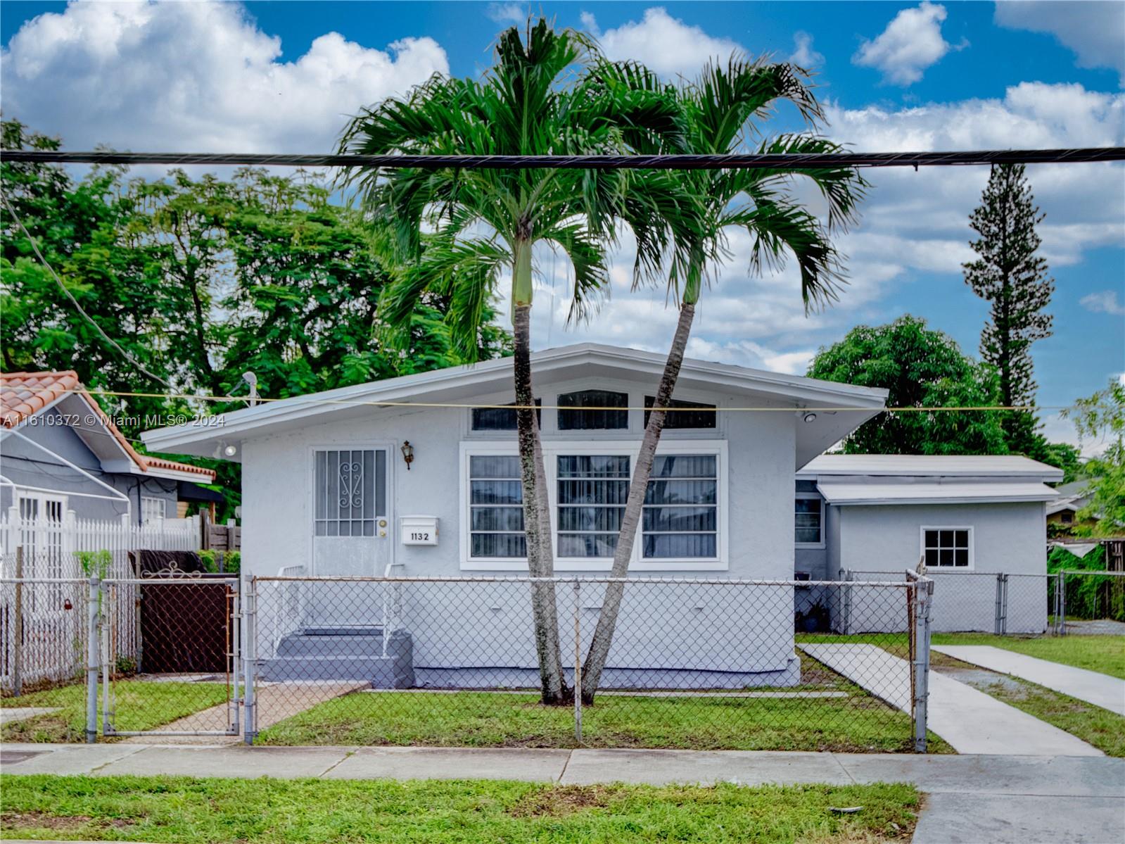 a view of house with yard