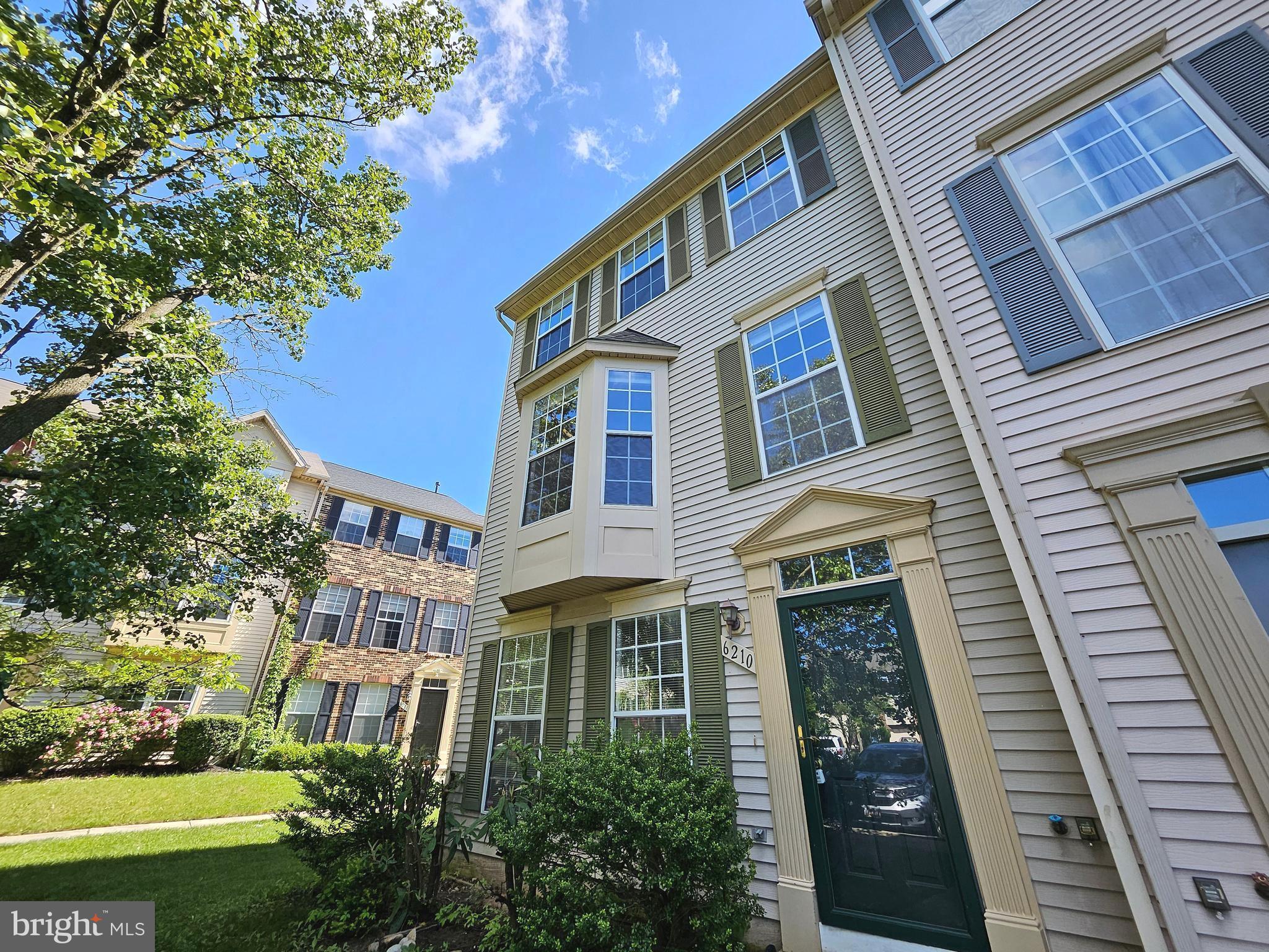 a front view of a multi story residential apartment buildings