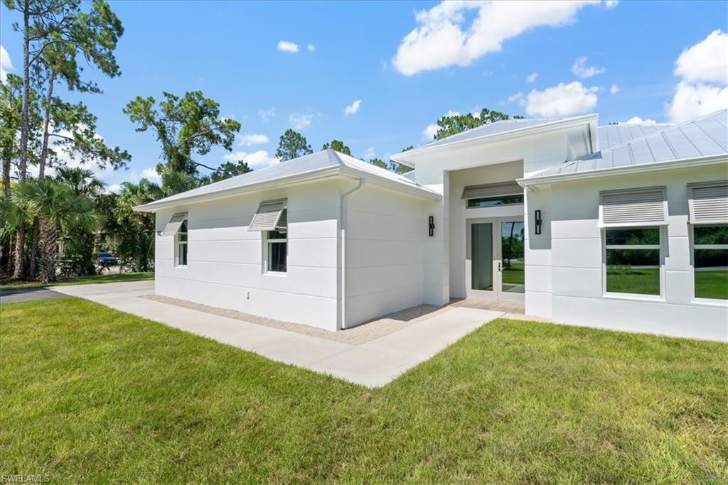 View of home's exterior featuring a lawn