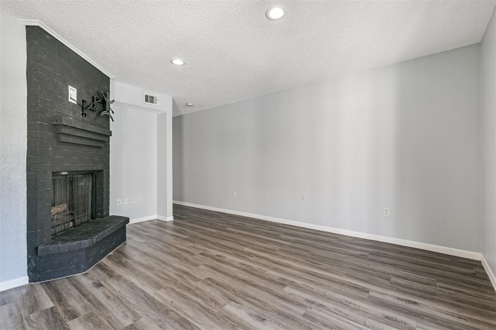 Great Upstairs Condo - No one is stomping on the floors above you! Working Fireplace is a Great Accent in this Nice Living Area!