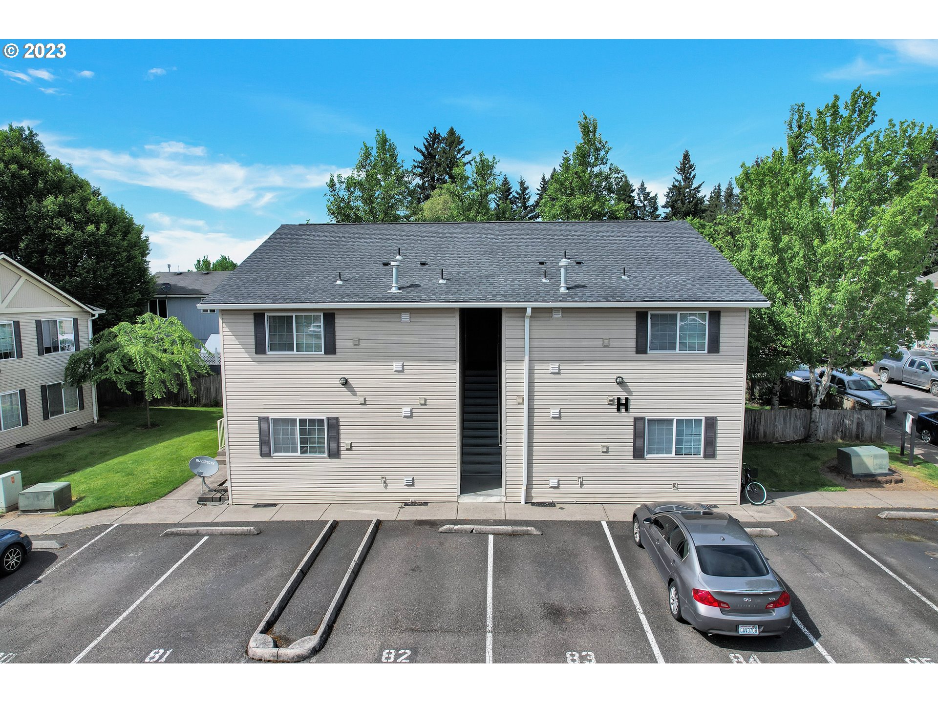 a aerial view of a house with a yard