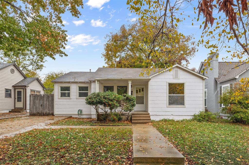 front view of a house with a yard