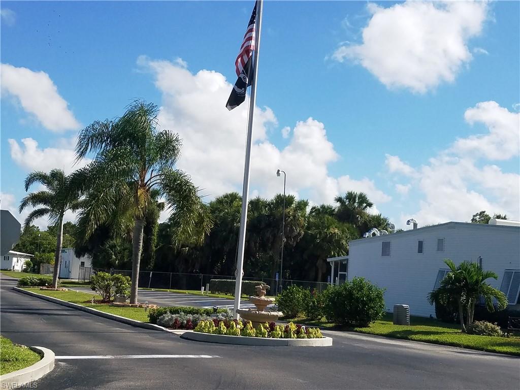 a view of a street with a building in the background