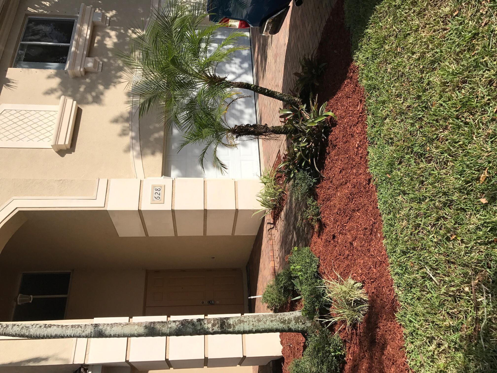 a view of a pathway both side of house