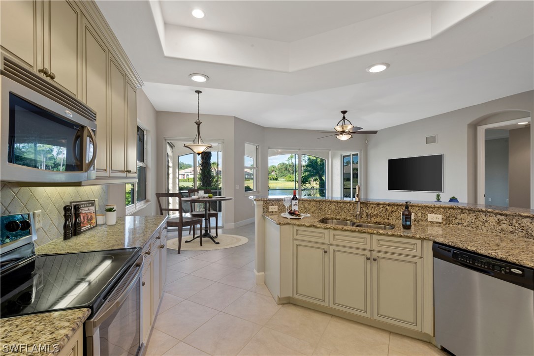 a kitchen with counter top space appliances and cabinets