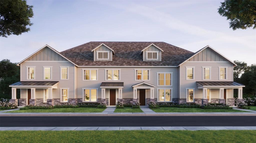 a front view of a residential apartment building with a yard