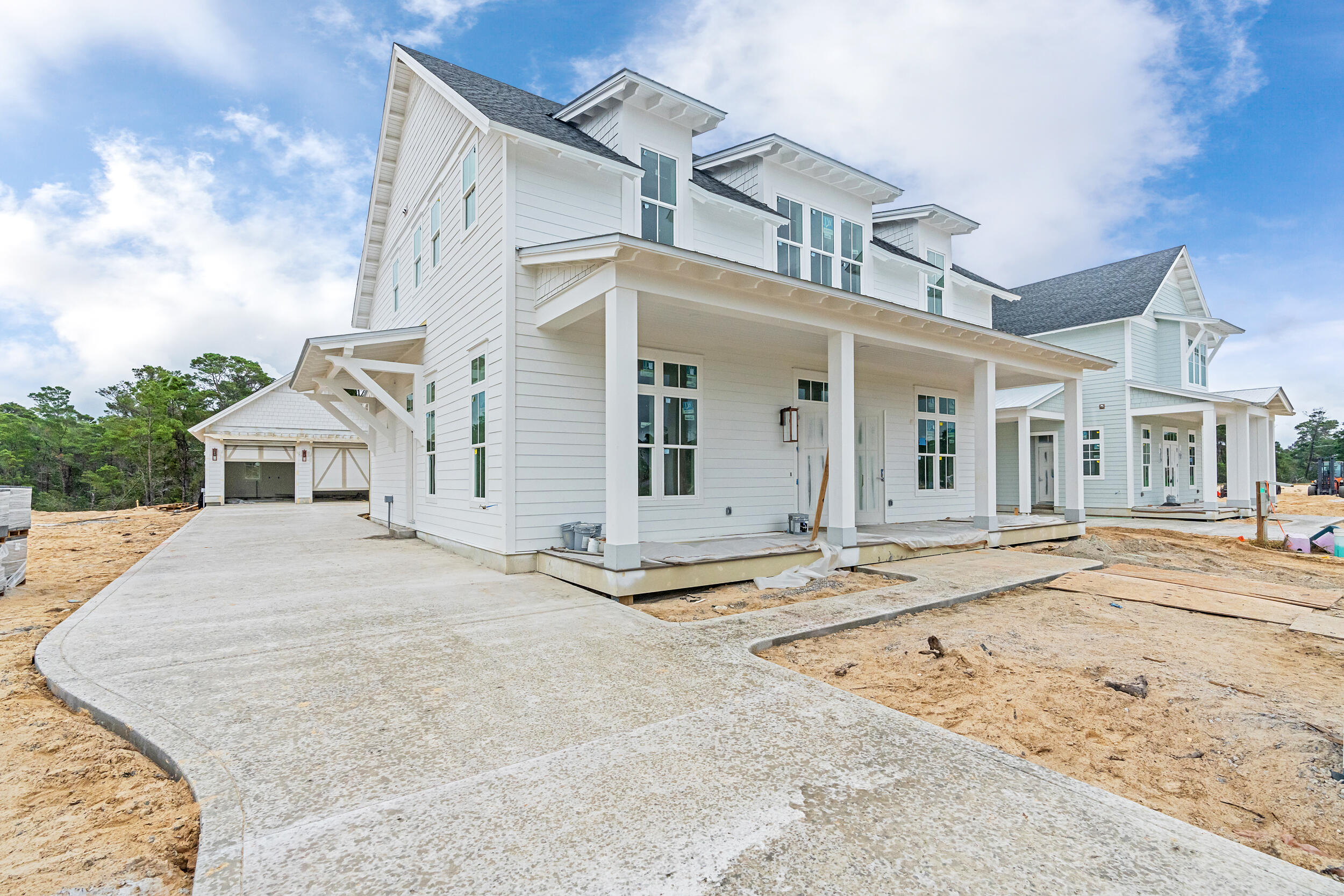 front view of a house with a wooden fence