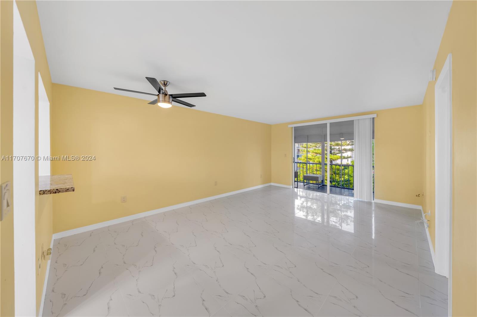 a view of an empty room with a window