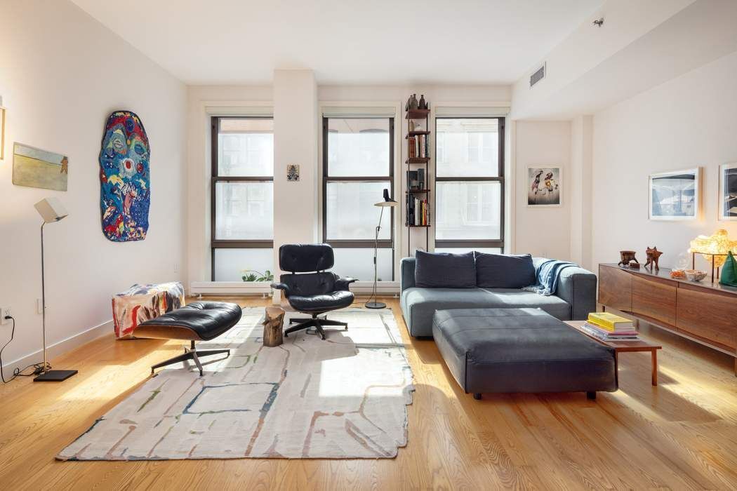 a living room with furniture and a window