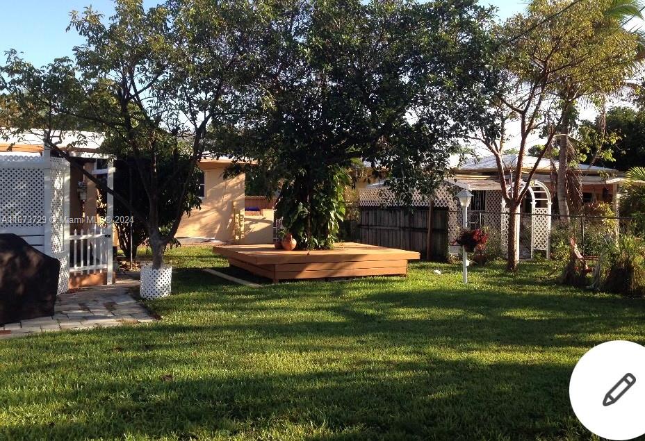 a view of a house with a yard porch and sitting area