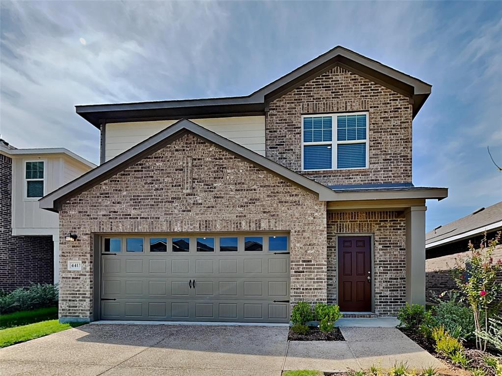 a front view of a house with garage