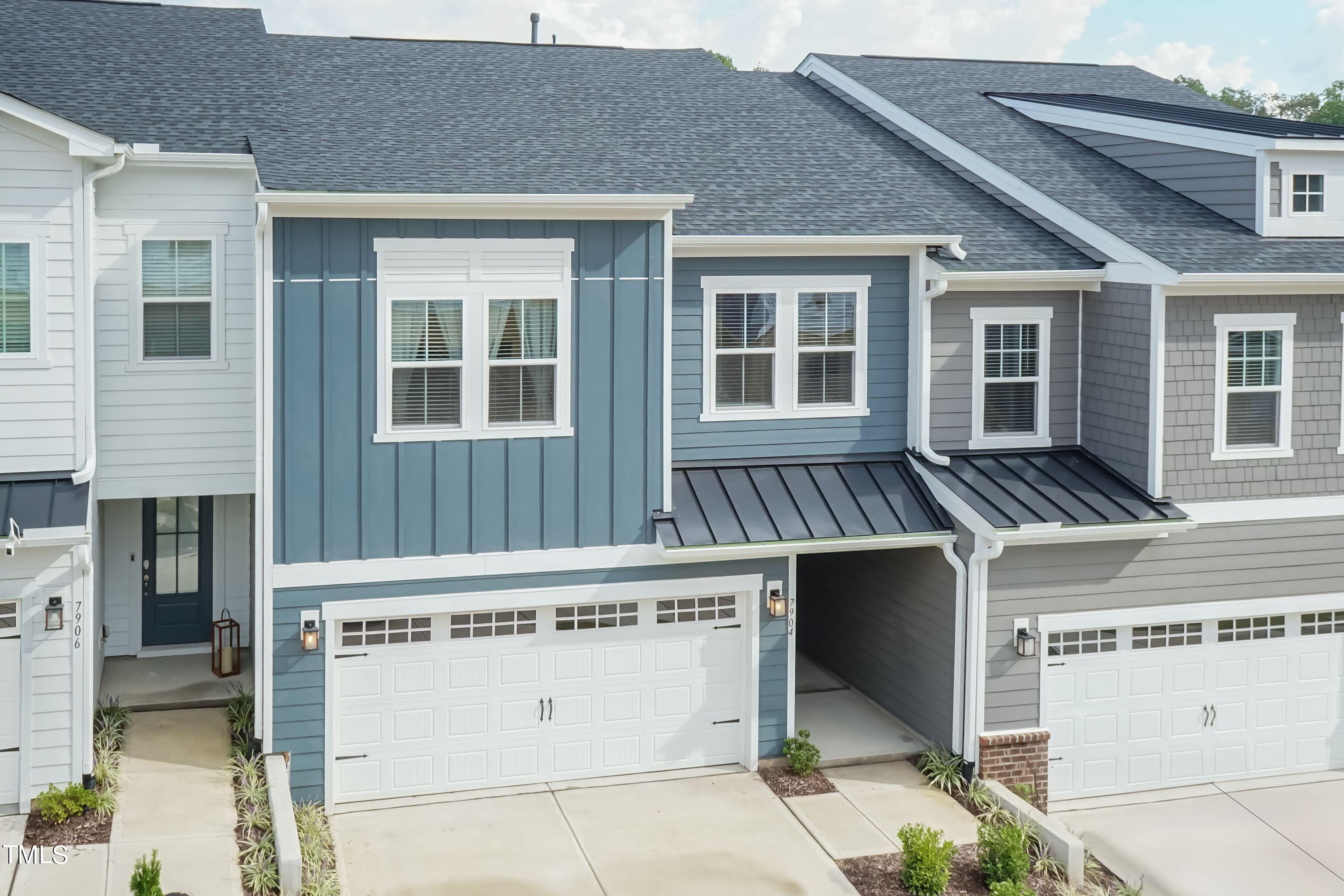 a front view of a house with a garage