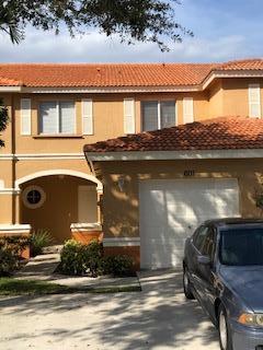 a view of house with yard