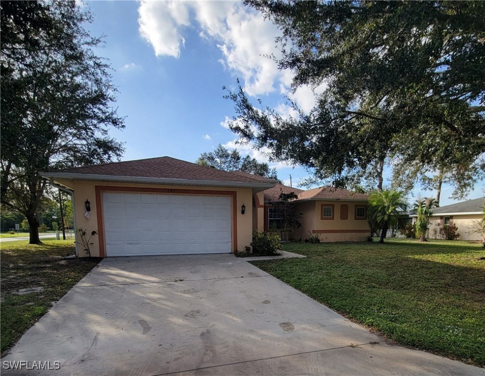 a house with yard in front of it