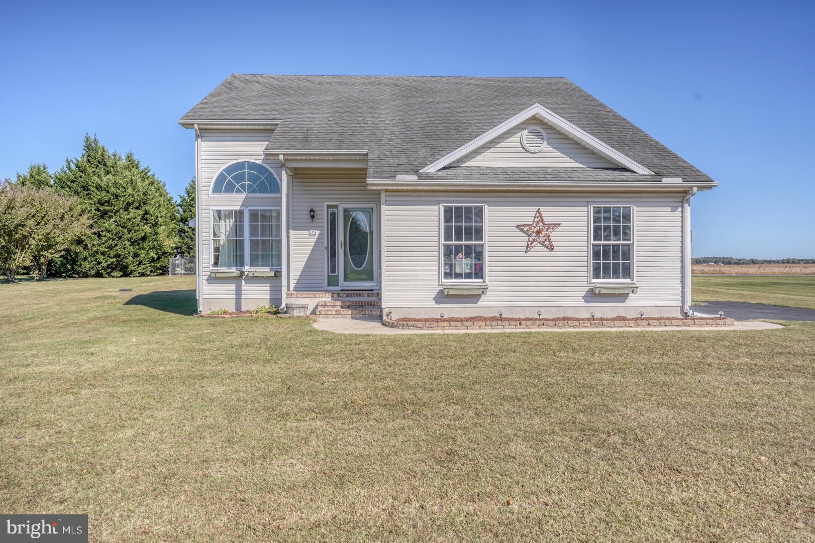 front view of a house with a yard