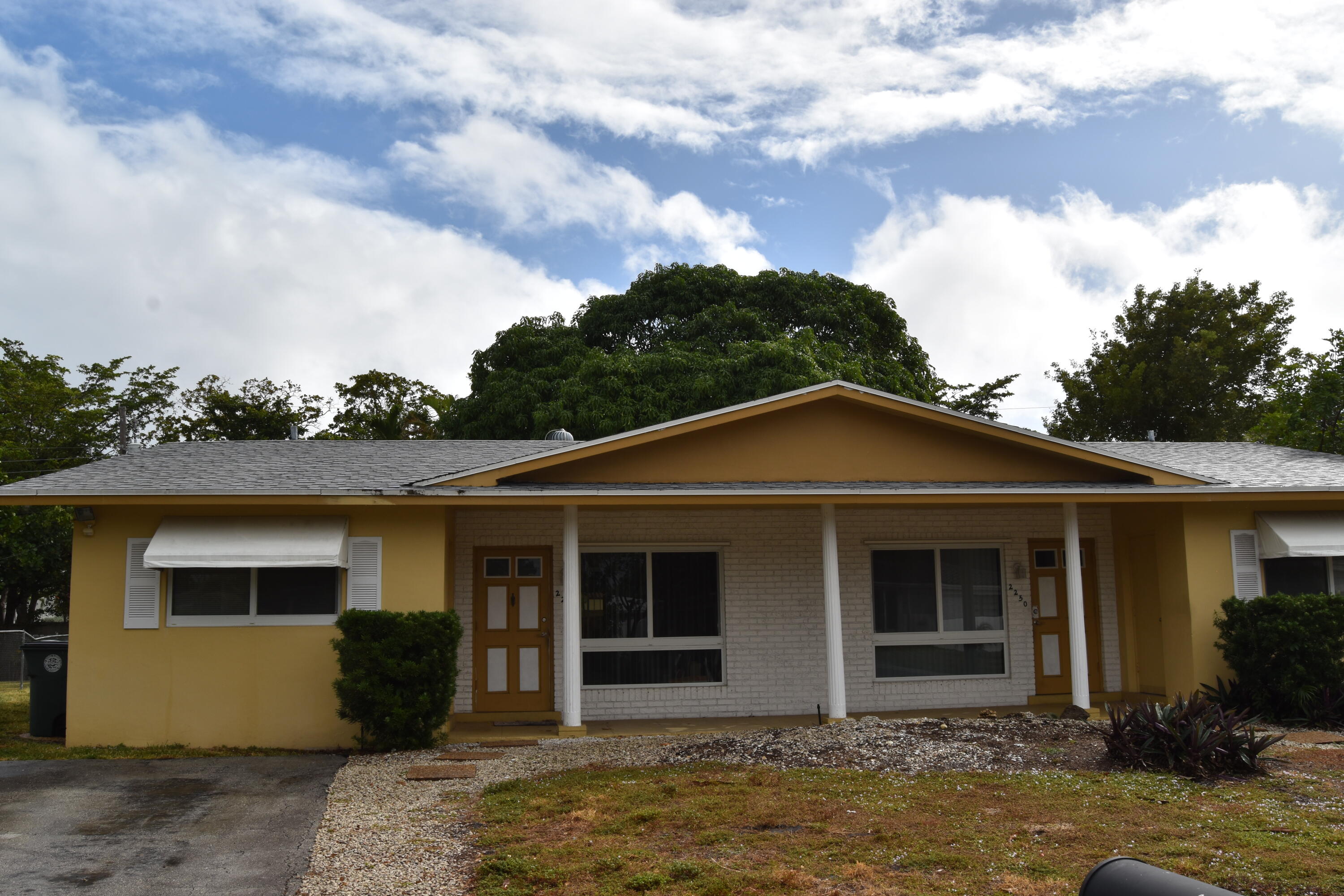 front view of a house with a yard