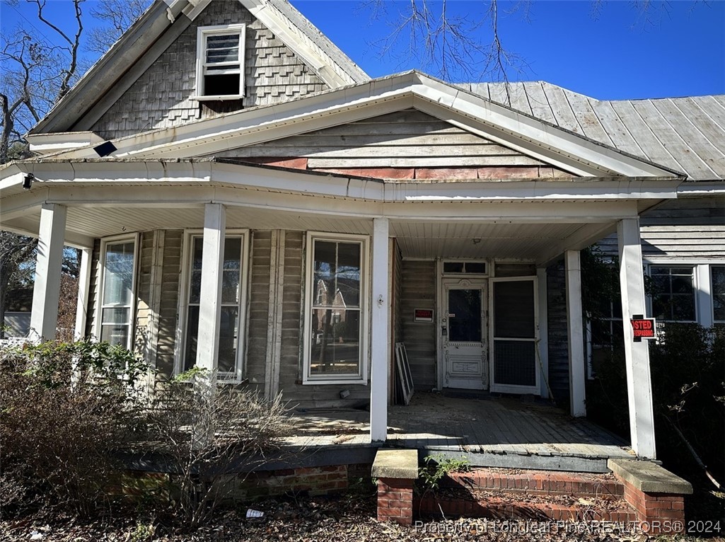 front view of a house with a large window