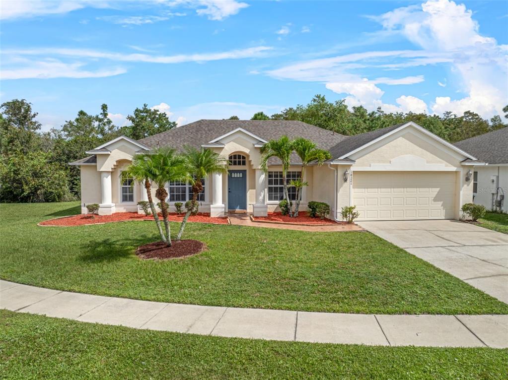 a front view of a house with a yard