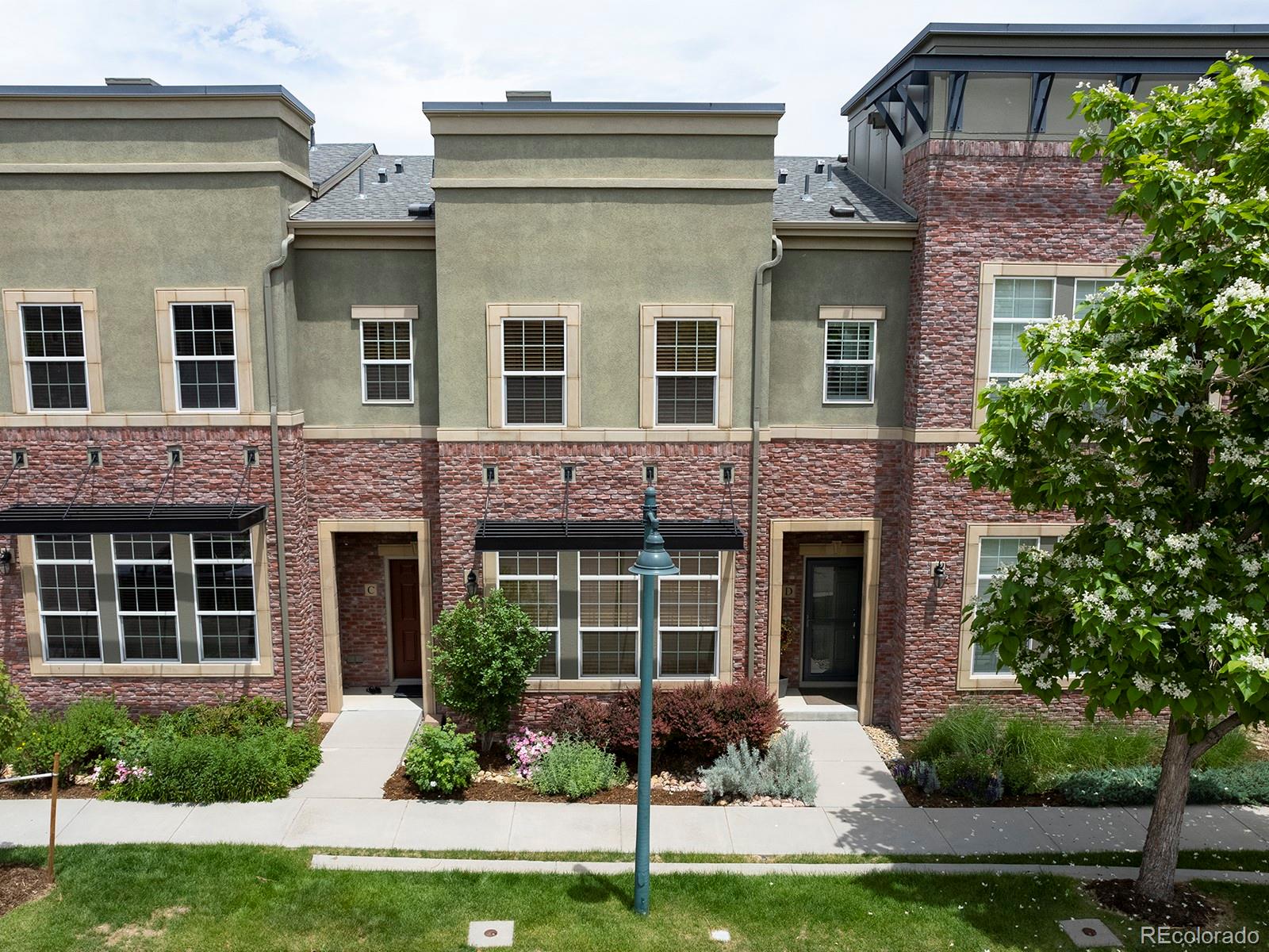 a house that has a small yard in front of it