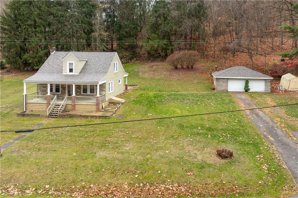 a view of a house with a yard