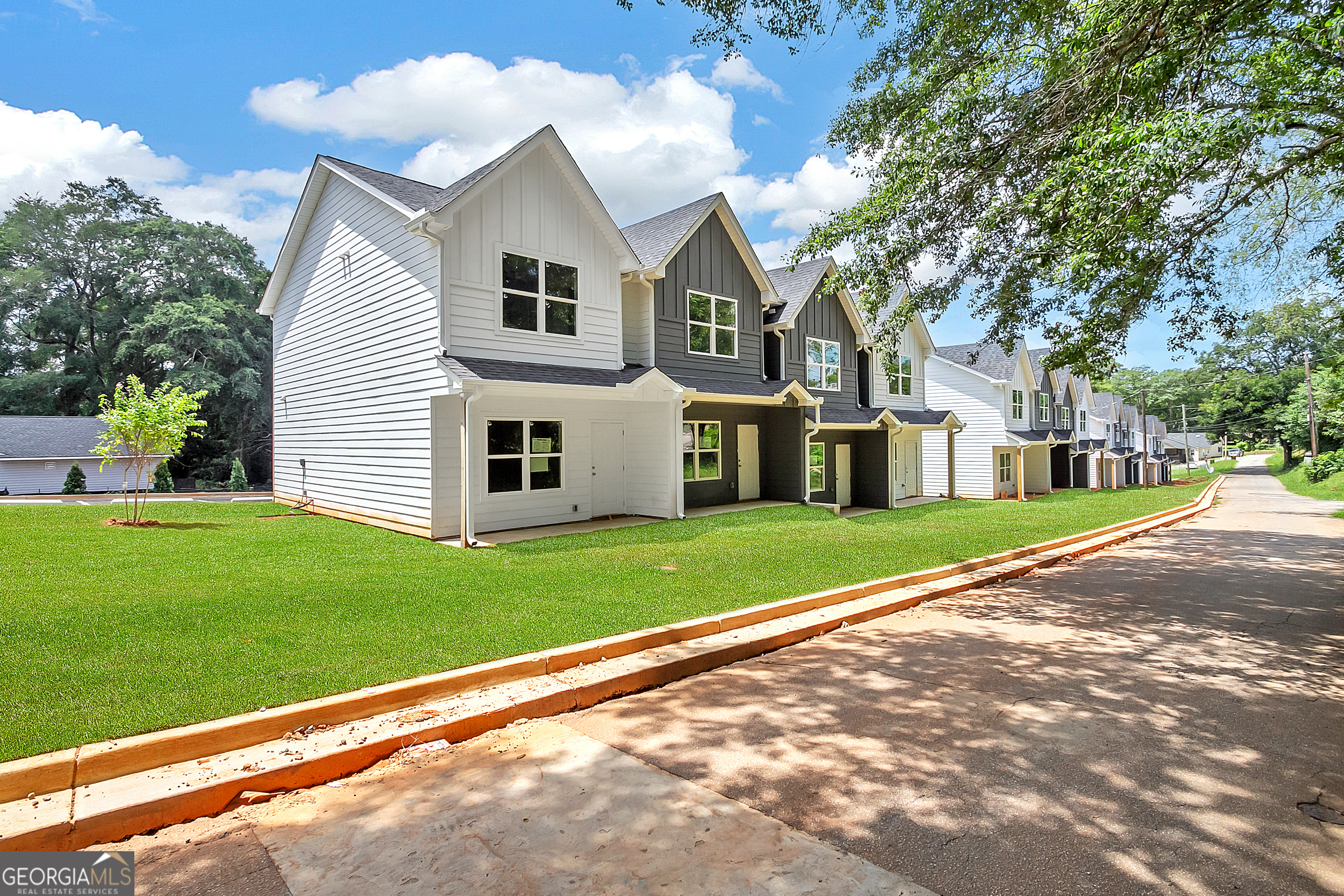 a front view of a house with a yard