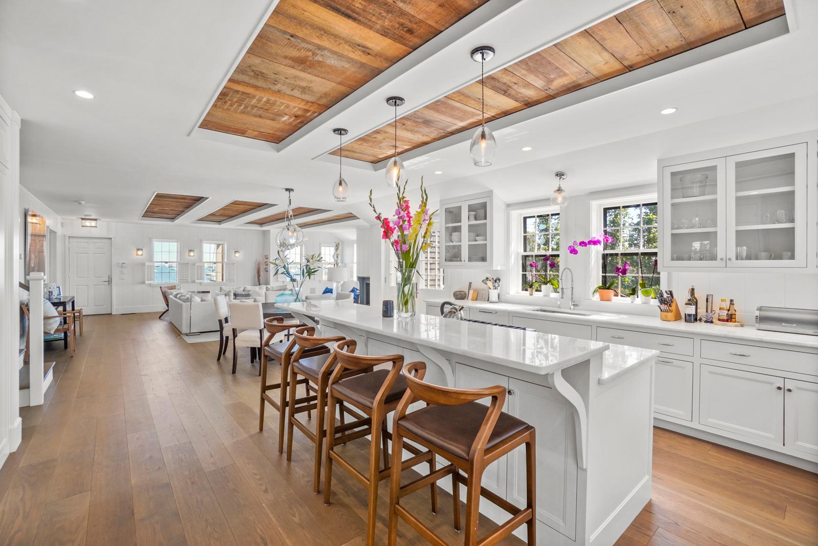 a kitchen with stainless steel appliances kitchen island granite countertop a table and chairs in it