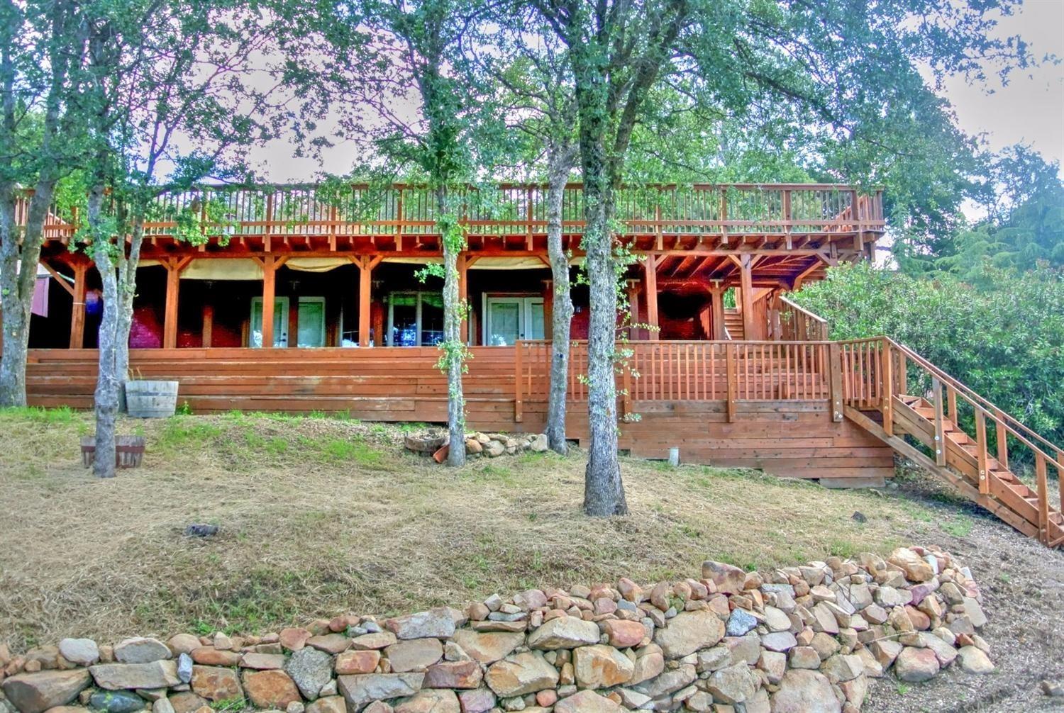 a view of a house with wooden fence