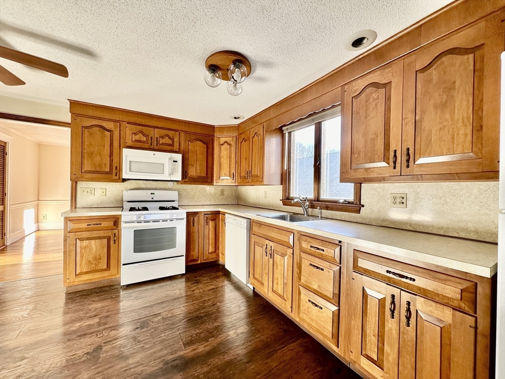 a kitchen with stainless steel appliances granite countertop a stove and a sink