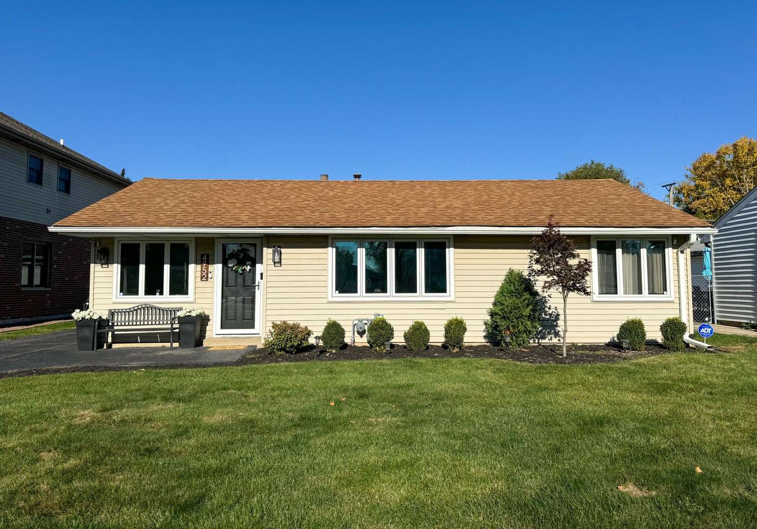 a front view of a house with a yard