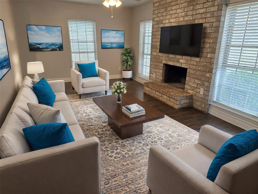 a living room with furniture and a fireplace