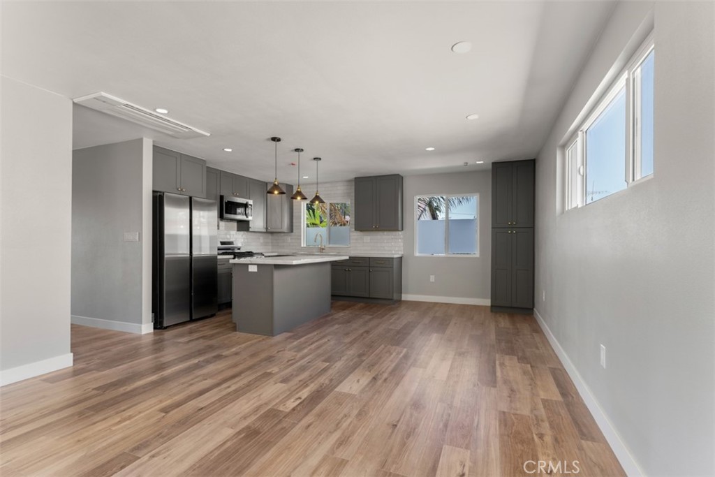 a view of kitchen with wooden floor