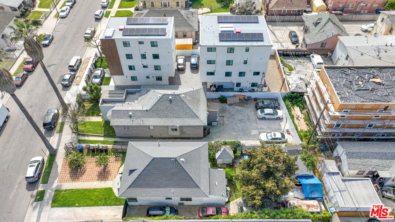 an aerial view of multiple houses with outdoor space