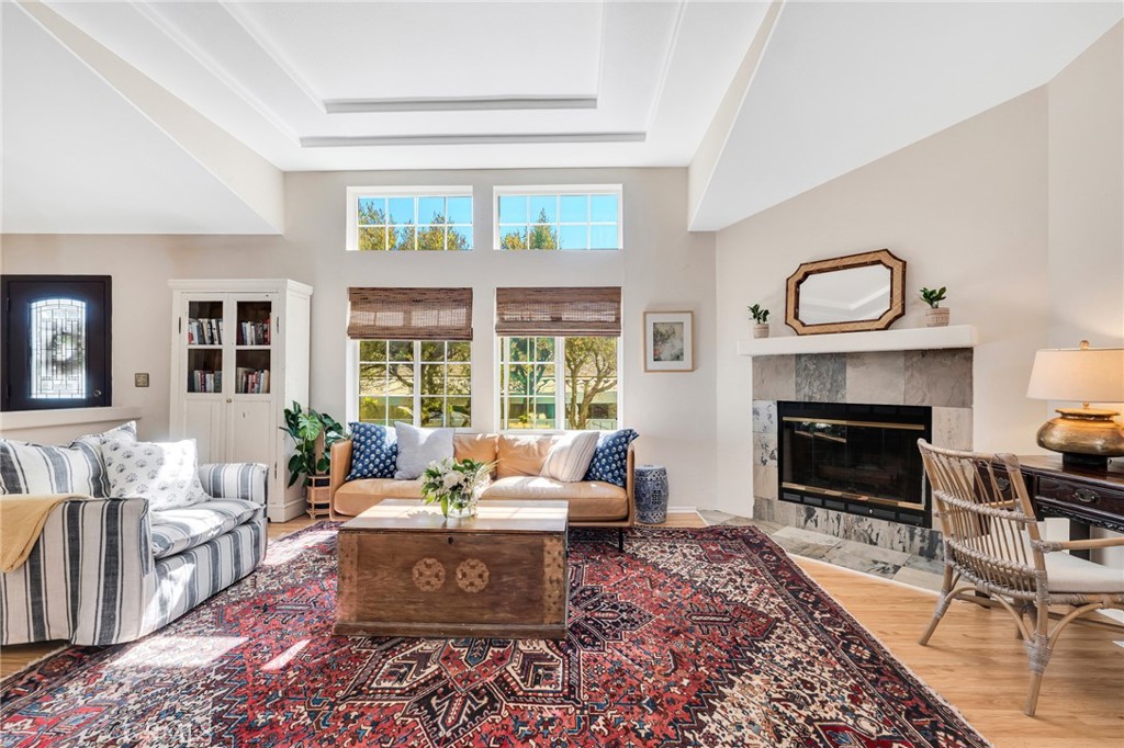 a living room with furniture and a fireplace