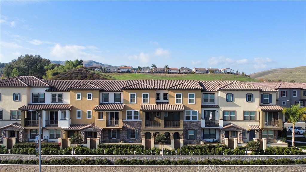 a front view of a residential apartment building with a yard