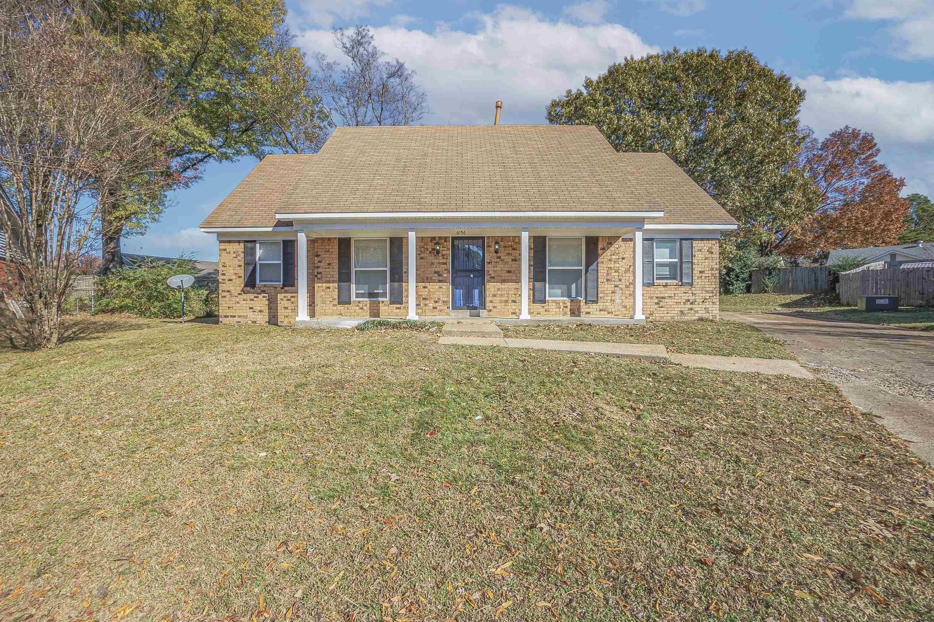 front view of a house with a yard