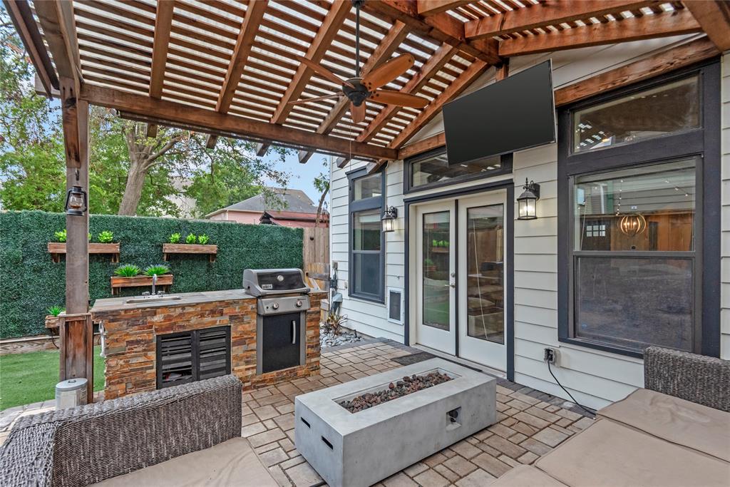 a view of a patio with a table and chairs