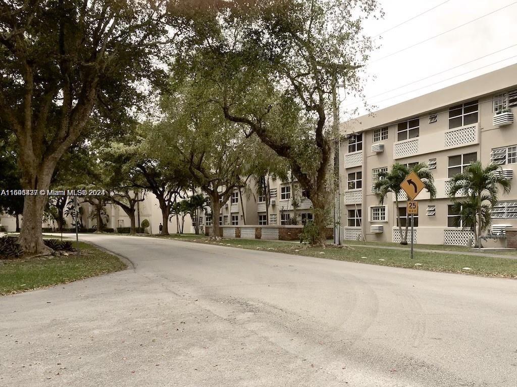 a view of a building with a yard