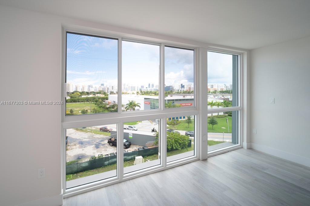 a view of a room with a large window