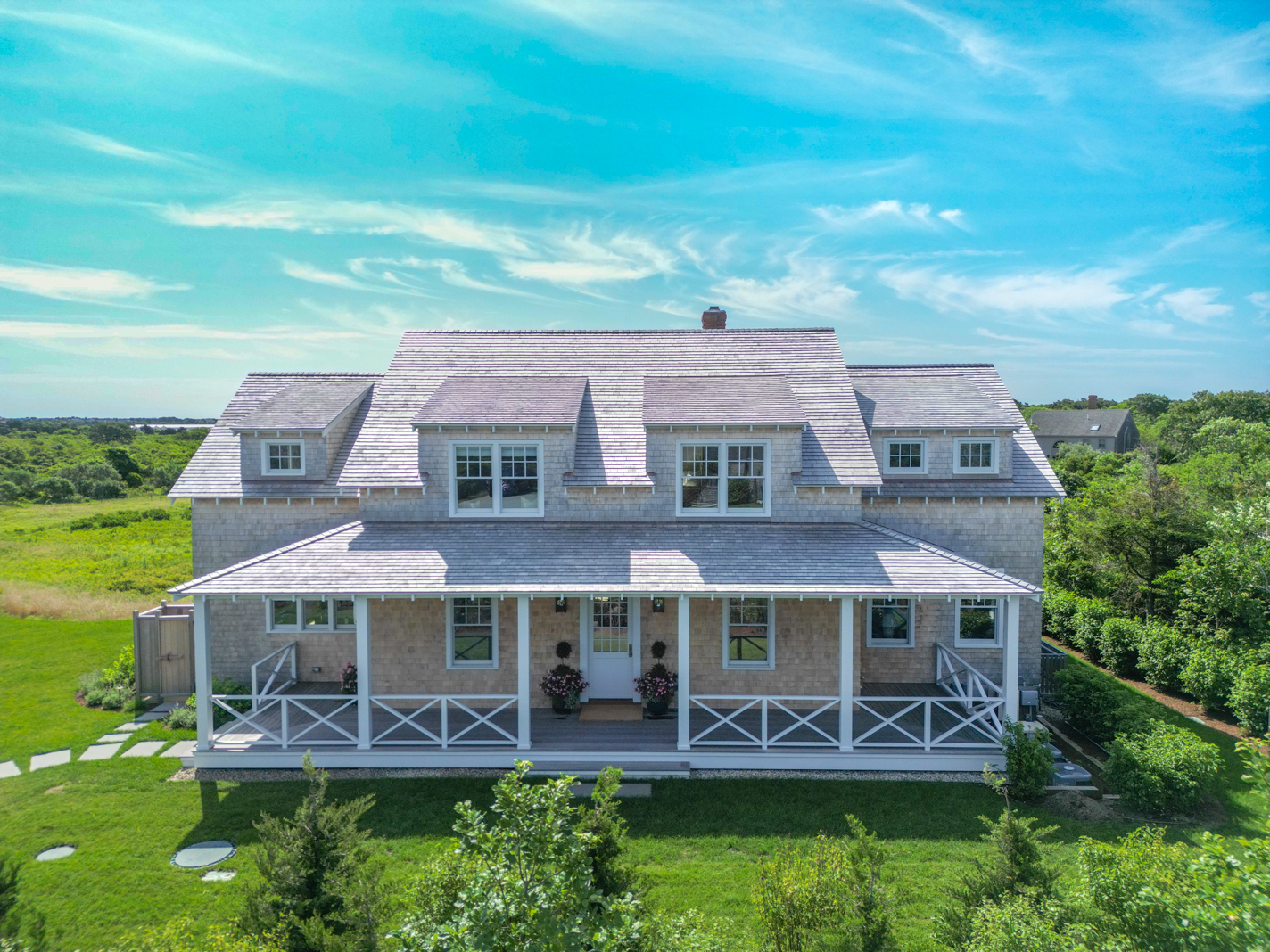 an aerial view of a house with a garden