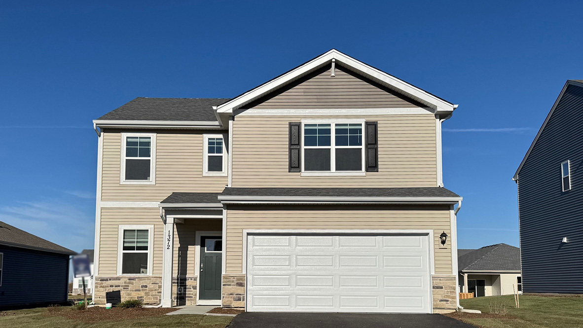 a front view of a house with a garage