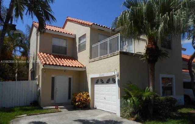 a front view of a house with a garage