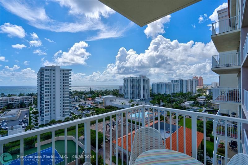 a view of a balcony with city view