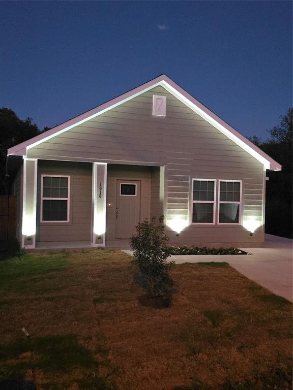 a front view of a house with yard