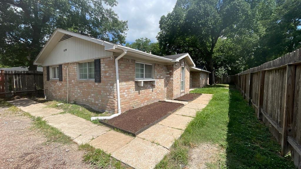 a front view of a house with yard