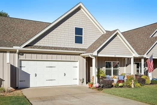 a front view of a house with garden