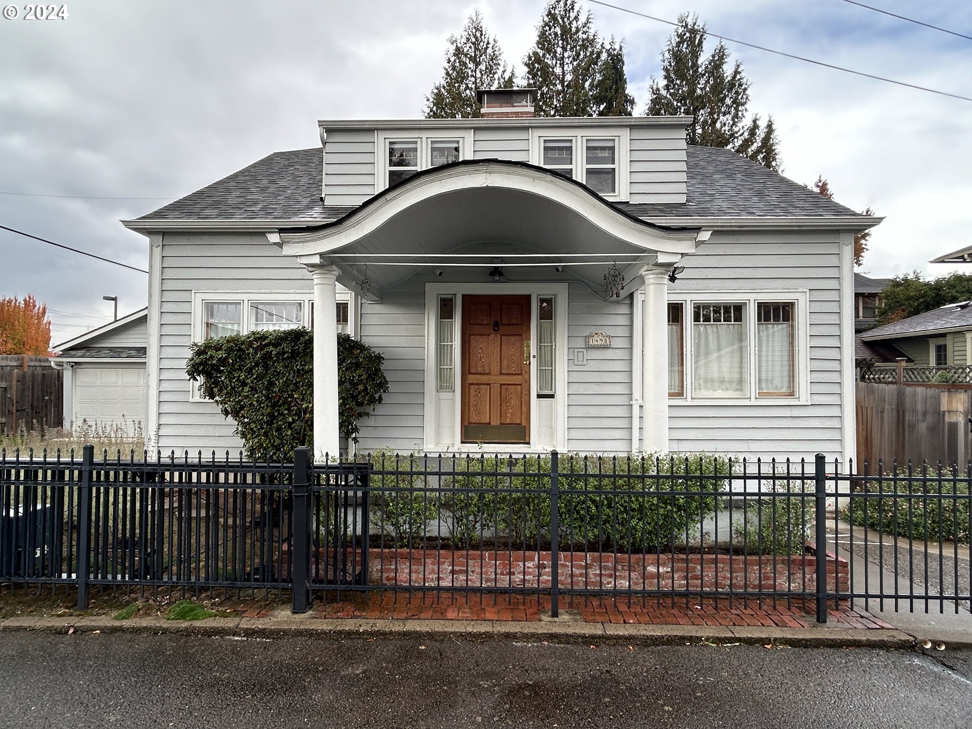 a front view of a house with garage