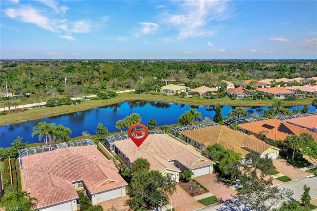 an aerial view of a house with a swimming pool yard and outdoor seating