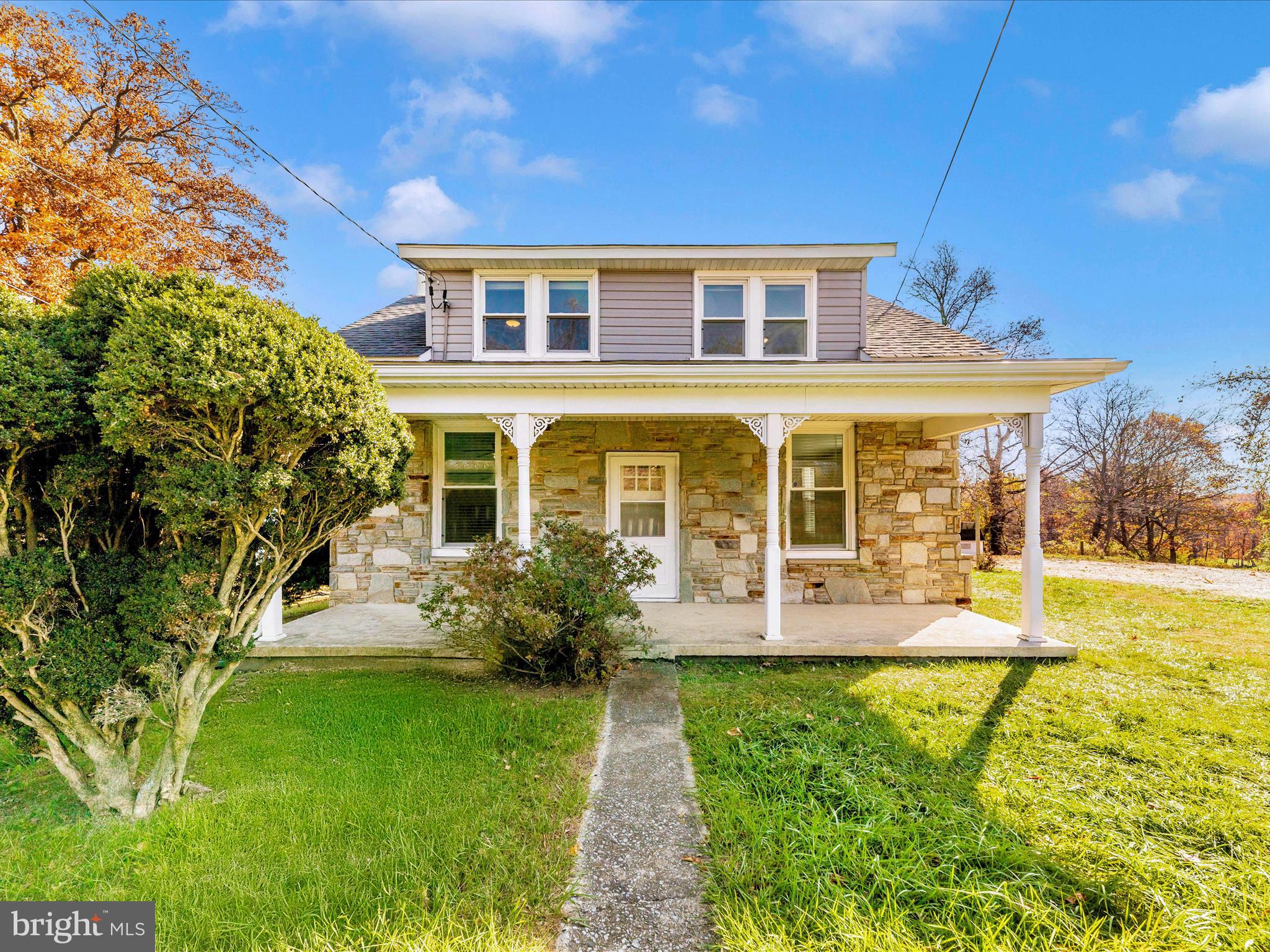 front view of a house with a yard