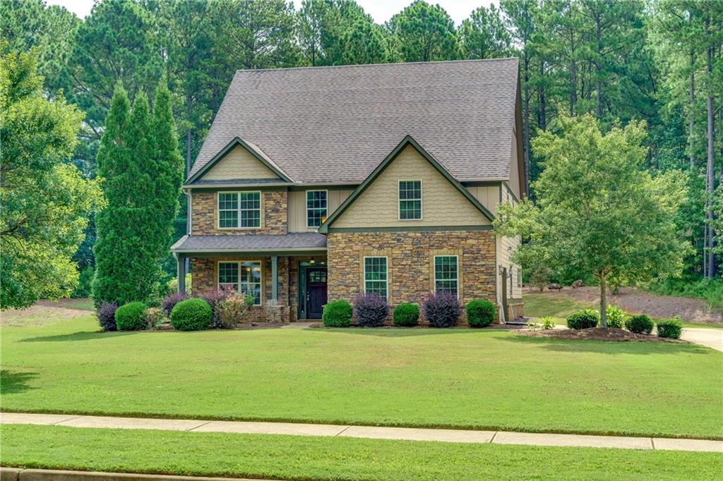 a front view of a house with a yard