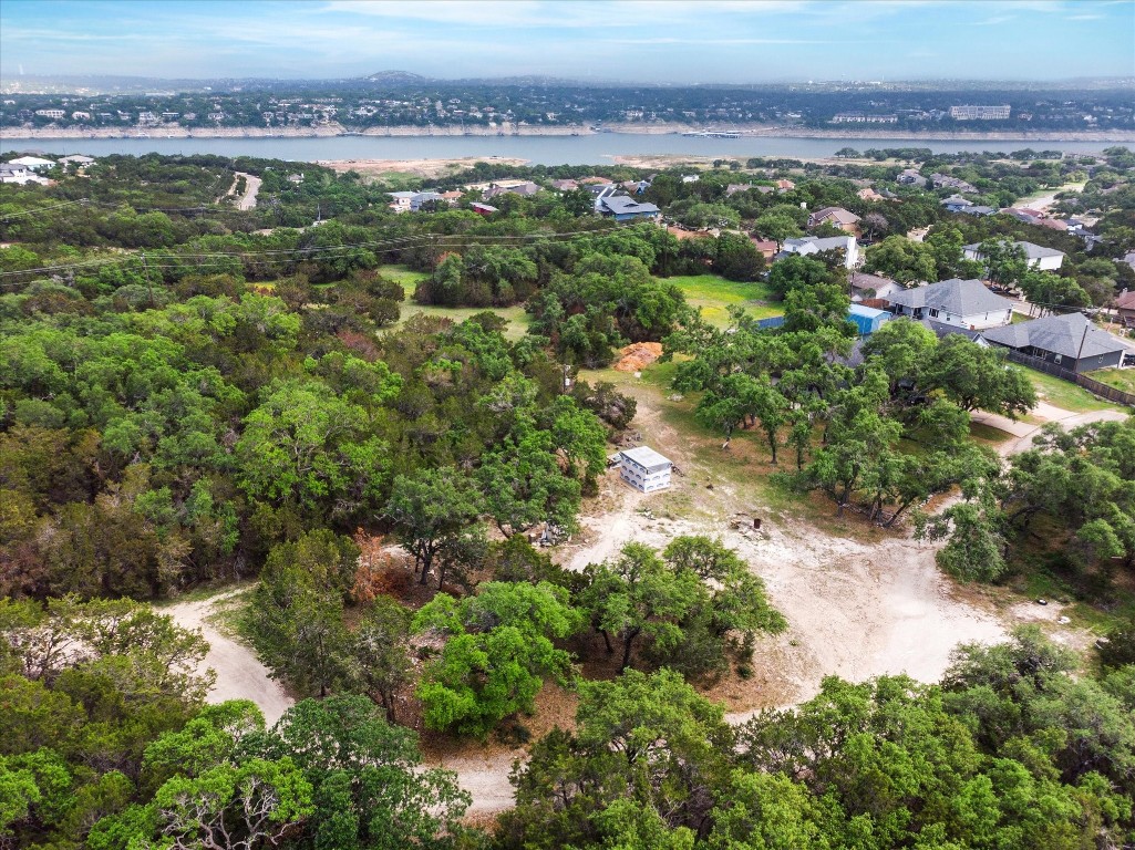 an aerial view of a houses with a yard